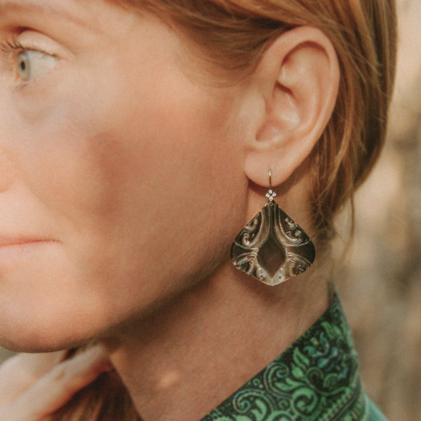 carved black mother of pearl shell and ocean diamond earrings